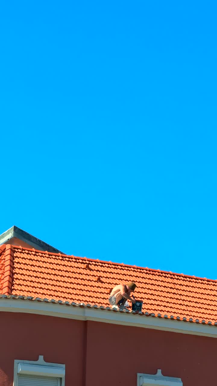 Man working on a rooftop