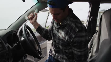 disabled man with wheelchair getting into his car