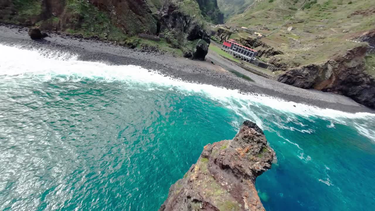 flying down a sea cliff on a beach