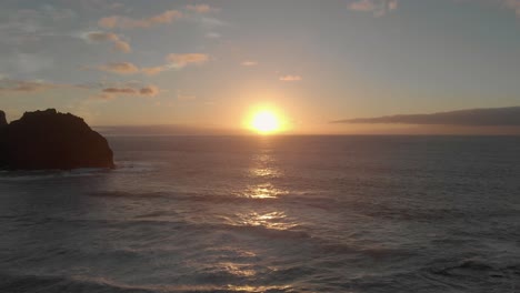 Sea-rock-near-Ponta-da-Calheta-beach-at-sunset,-Portugal