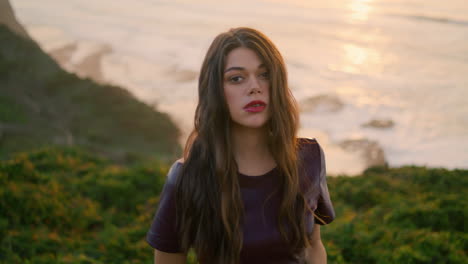 woman enjoy coast walk calm evening close up. romantic girl posing on nature