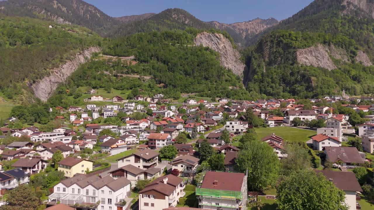 Trimmis, switzerland during spring with green landscapes and residential homes, aerial view