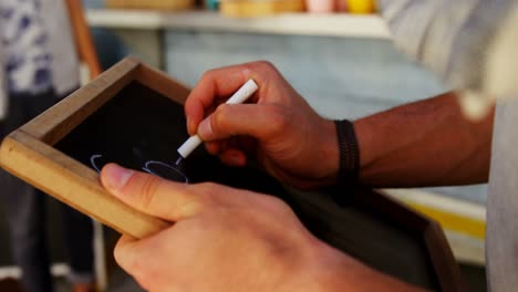 Waiter-writing-on-slate