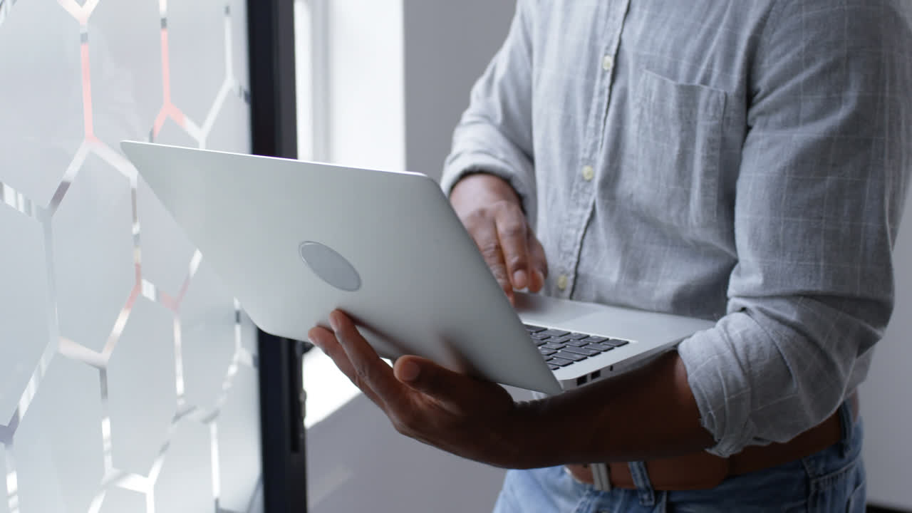 Businessman using laptop at office 4k