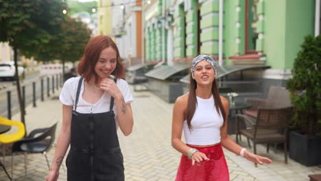 two friends walking down a city street