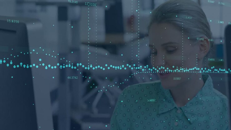 Statistical data processing against caucasian woman smiling while working at office