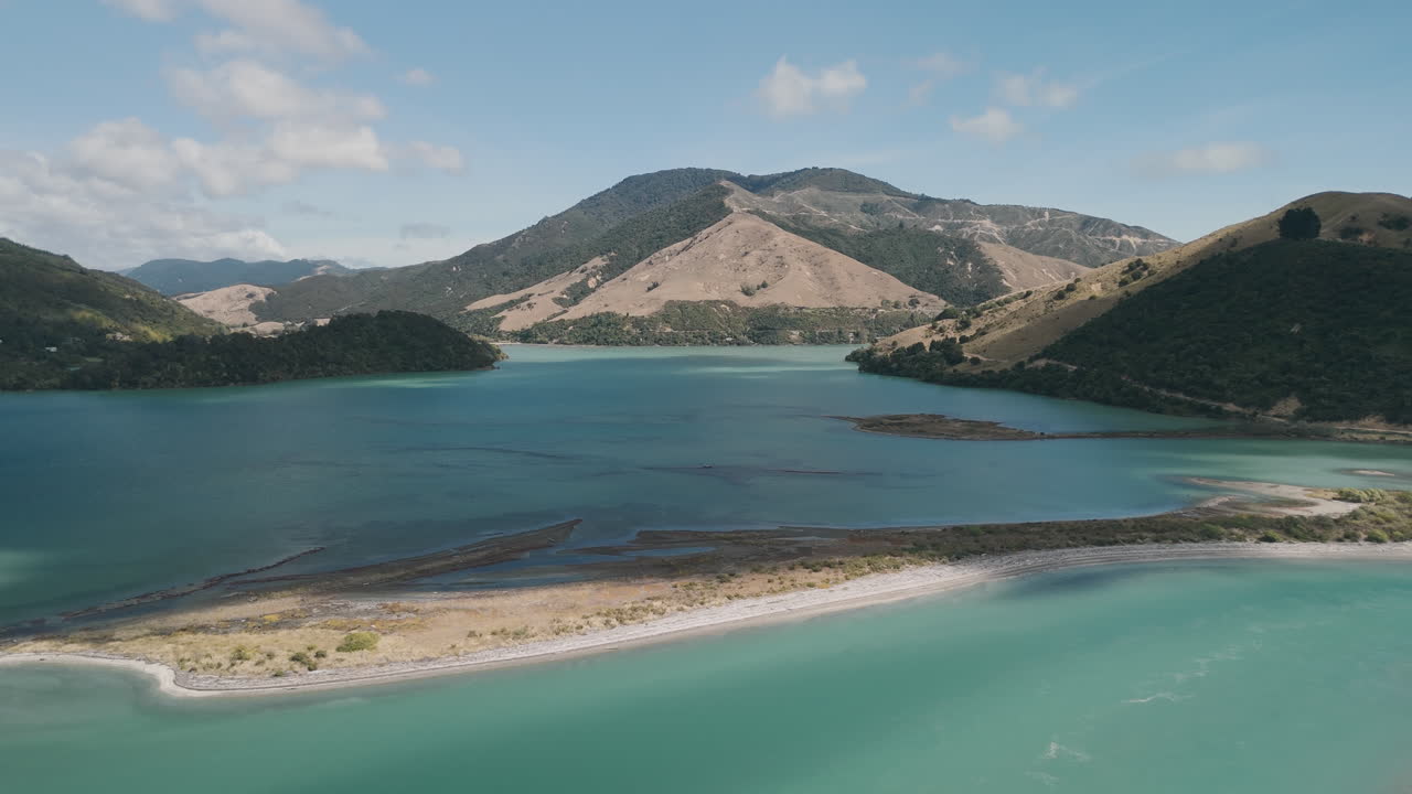 Aerial View of a Serene Bay and Mountains