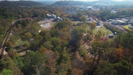 aerial descent into wooded creek area in old town helena, alabama