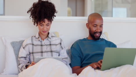 Bedroom,-home-and-couple-with-a-laptop