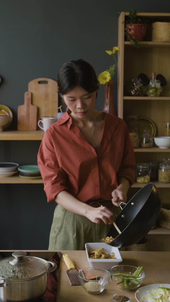 Woman Cooking Stir-fry in Her Kitchen