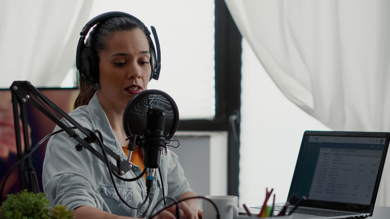 Social media star putting on headphones while starting video blog and talking to audience