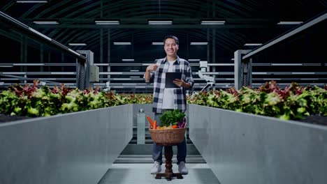 smiling farmer in a modern greenhouse