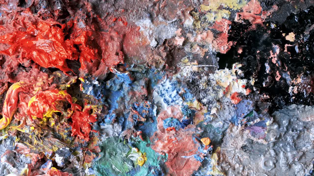 Used palette in a studio with a lot of dry paint on it