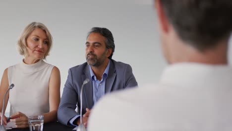 two business delegates talking at a conference
