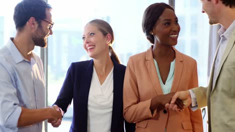 businesspeople shaking hands with each other