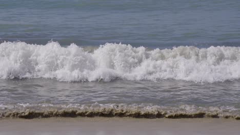 waves slowly crash at the mexican beach of bucerías