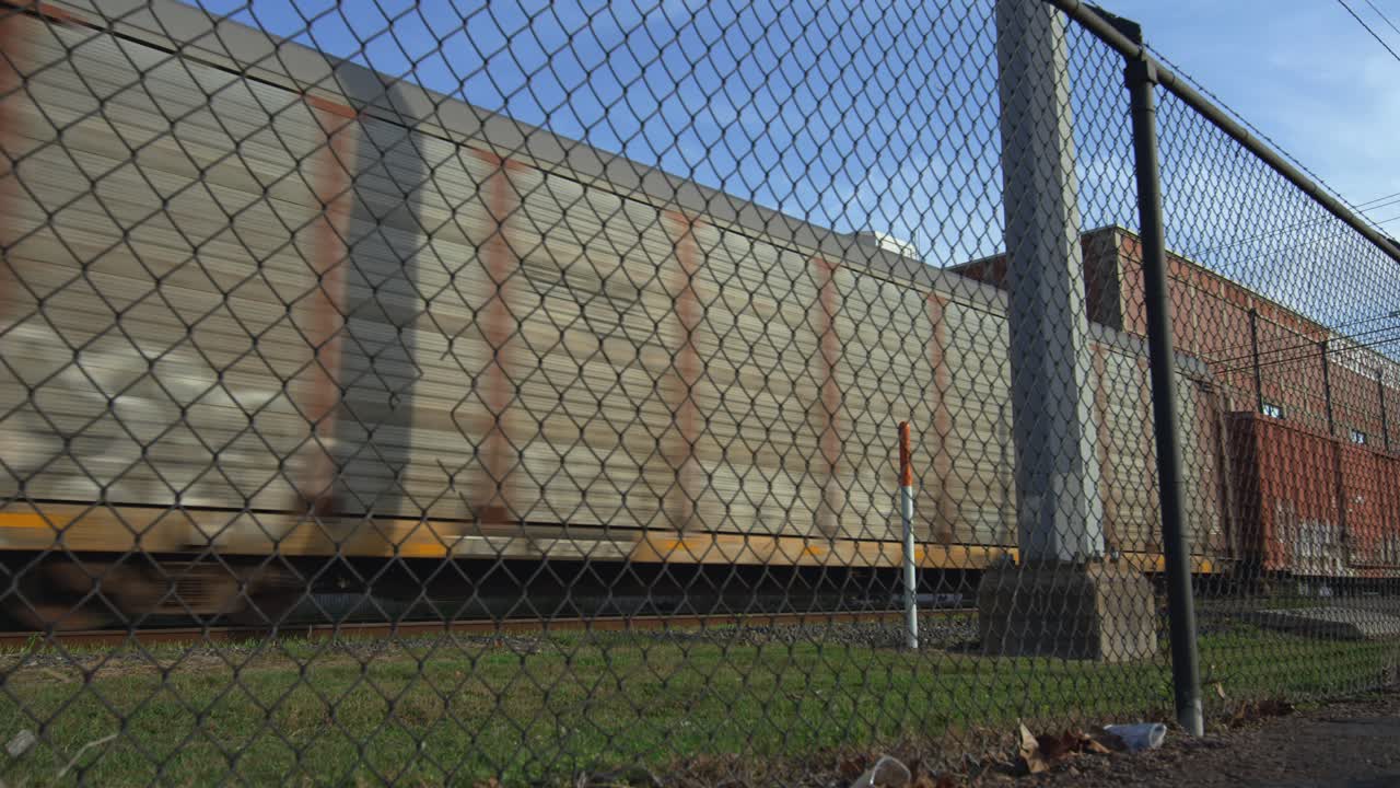 Establishing shot train on train tracks moving cargo