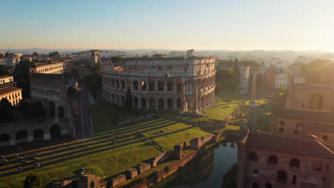 aerial view of the colosseum in rome at sunrise