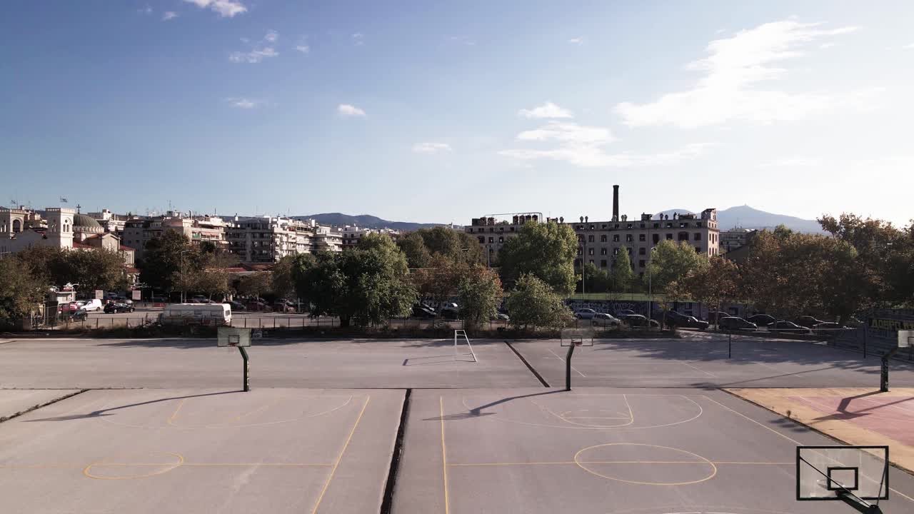 4K drone clip flying through baskeball courts in a sports complex in Thessaloniki, Greece