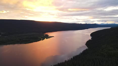 beautiful glowing sunset over the breathtaking dease lake in british columbia, canada