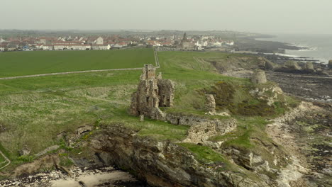 an aerial view of newark castle on the fife coastal path, scotland