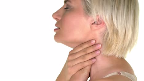 profile of a woman suffering from sore throat and massaging with her hands on the neck.  isolated on white studio background