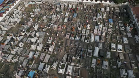 Low aerial flyover of church yard cemetery on Mixquic Day of the Dead