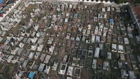 low aerial flyover of church yard cemetery on mixquic day of the dead