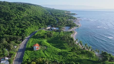 tropical sunrise coastline in caribbean countryside with remote houses on road