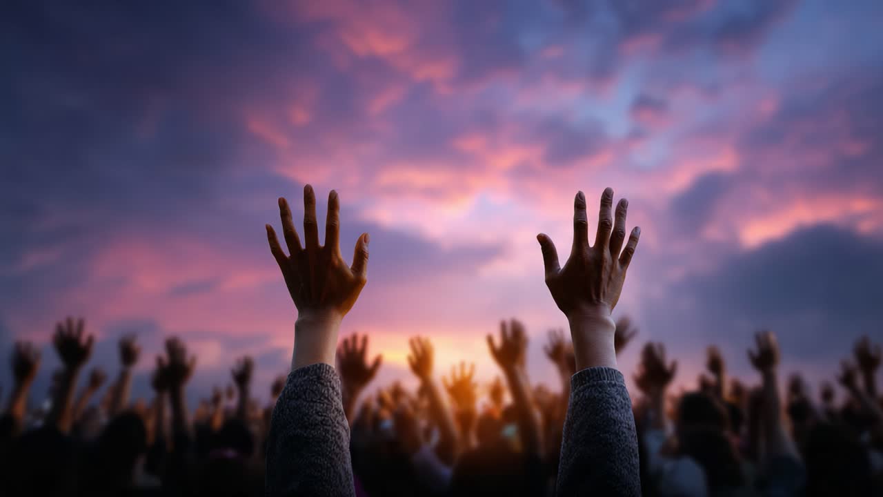 A Vibrant Sunset Illuminates the Collective Spirit of Hope as Hands Reach Upward, Uniting in Expression and Solidarity Against a Colorful Sky