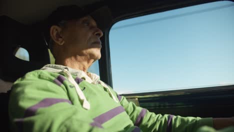 man driving car while monitoring gauges