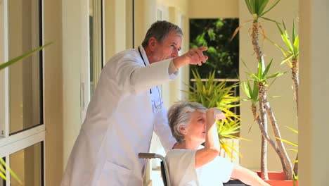 Lady-in-a-wheelchair-with-her-doctor