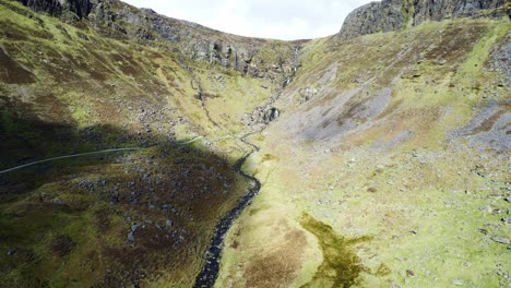 aerial reveal of the mahon valley and mahon falls in the comeragh mountains on a bright but blustery spring day nice establishing shot