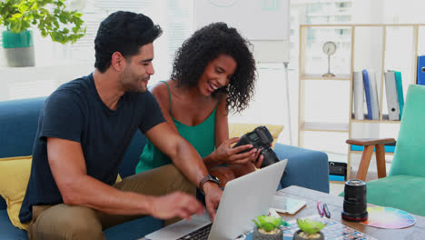 graphic designers interacting with each other while looking at photos 4k