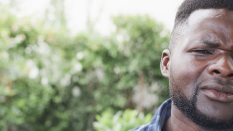 Close-up-of-an-African-American-man-outdoors,-with-copy-space