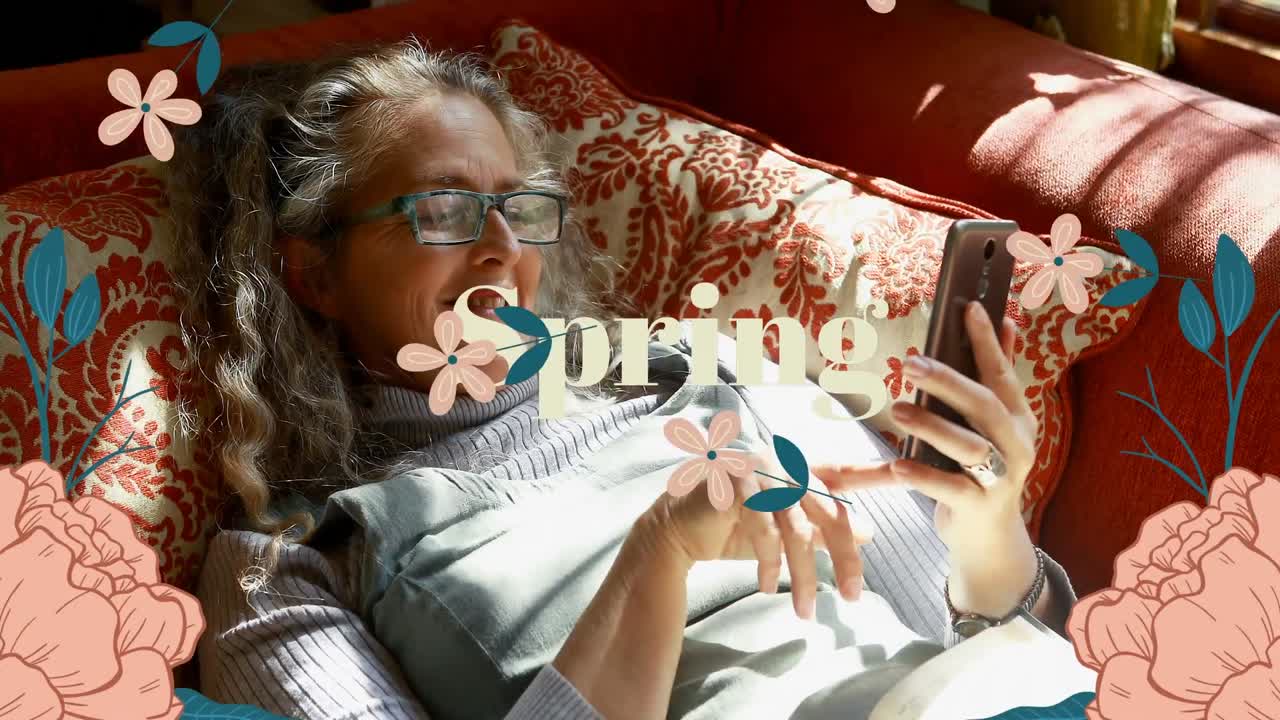 Animation of flower icons and spring text over biracial woman using smartphone