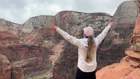 a woman enjoys a vacation at the canyon of zion a breathtaking view from zion canyon that captures the essence of adventure and the exquisite beauty of nature