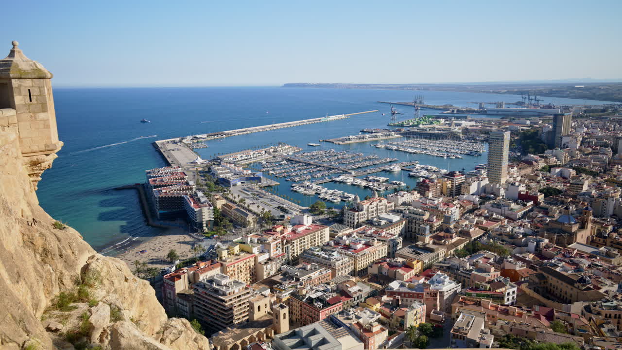 Panoramic view from Castillo de Santa Barbara across Alicante, Spain and port packed with sailboats