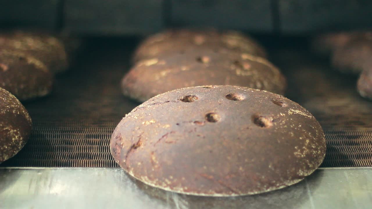 Bread manufacturing line. Bread factory conveyor belt. Food processing. Bakery