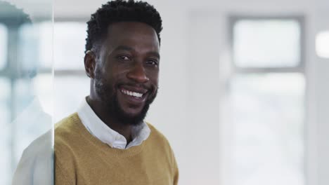 portrait of man smiling in office