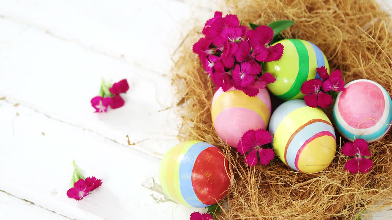 Multicolored Easter eggs in the nest