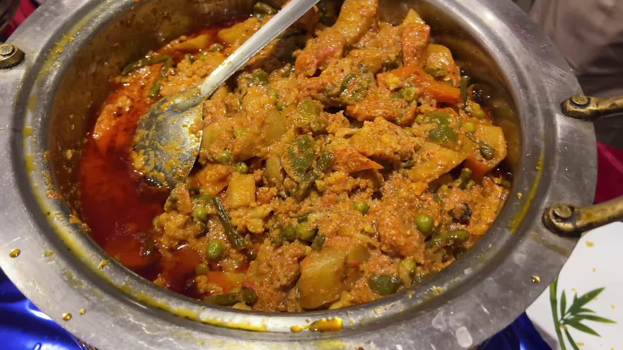 Cinematic shot of mixed veg prepared in Bengali wedding.