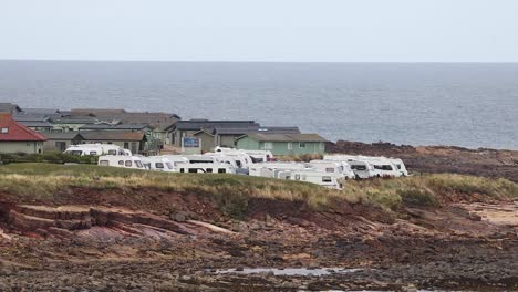 seaside buildings and caravans near the ocean