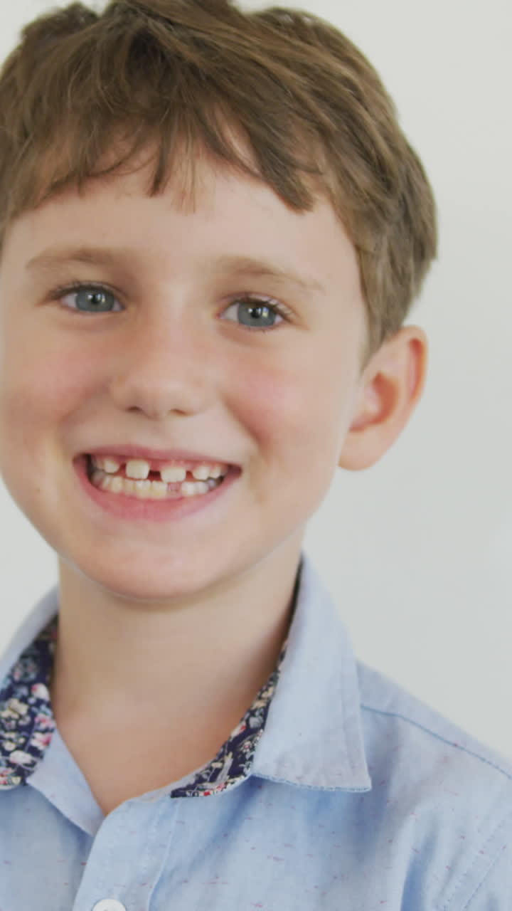 Video of happy caucasian boy standing in class during lessons