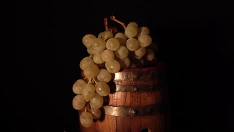 a bit closer view and backward rotating wine barrel with grape