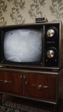 a vintage zenith television with static on screen in a retro setting