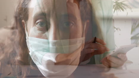 woman working over woman with mask.