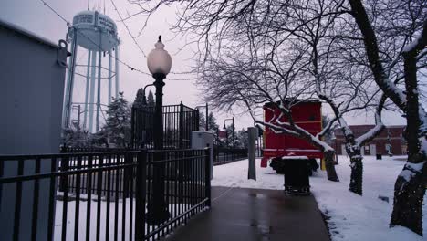 snow day on walkway to train station near water tower