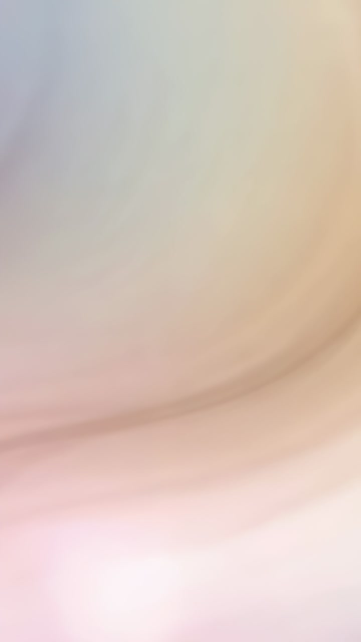 Vertical video: Playing pastel gradient filling frame, blending cool left with warm right tones