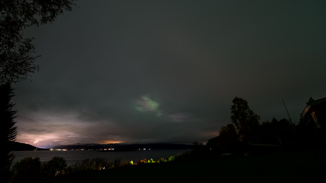 Motion Timelapse Of Aurora Borealis And Star Trails On Night Sky. Northern Lights.